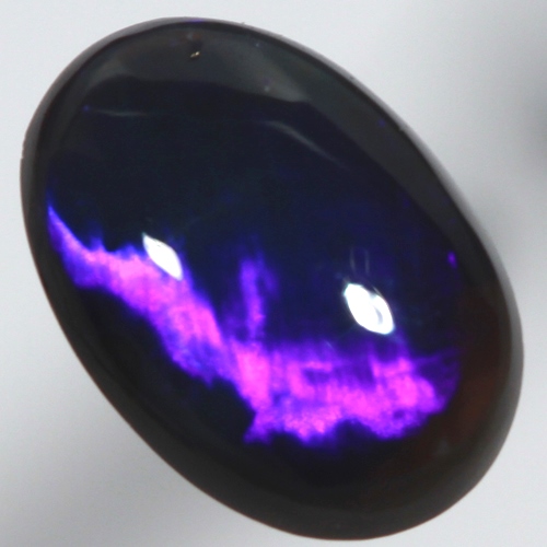 SOLID BLACK OPAL Bright electric blue. Broad rolling flash